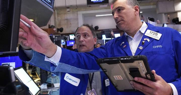 Wall Street drifts as tech stocks climb and oil prices sink