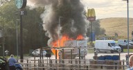 Moment blaze rips through van parked on McDonald's car park