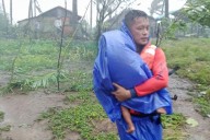 Super typhoon blowing by northern Philippines and Taiwan forces evacuations and closures
