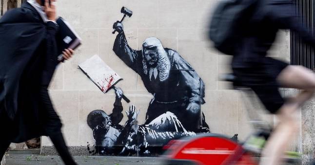 New Banksy showing judge hitting protester with gavel appears on High Court