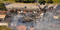 Police remain on scene at burned out Michigan church after shooting and fire leave 4 dead, 8 wounded