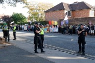 Manhunt after hotel with asylum seekers has flare shoved through window
