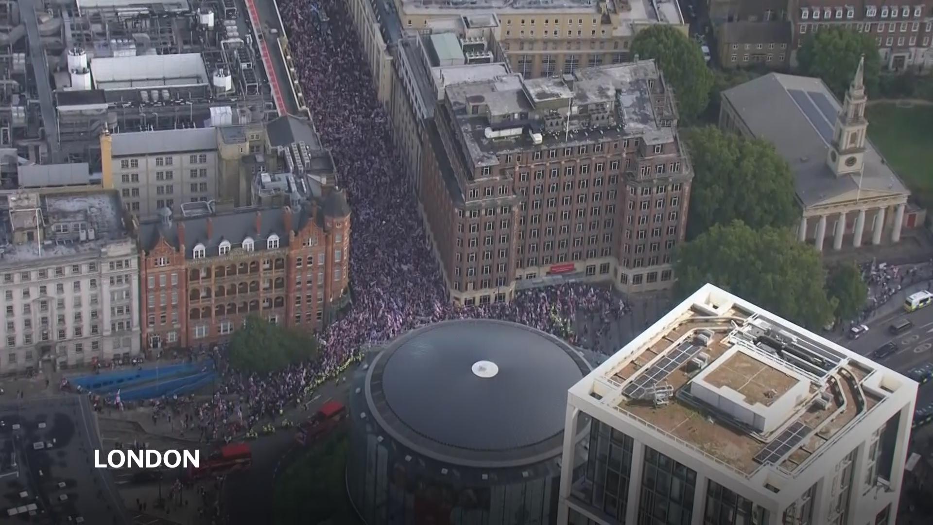 Thousands converge on central London for march organised by far right figure known as Tommy Robinson