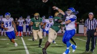 Hendricken rolls past Cumberland In High School Football.