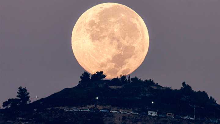 See photos: Total lunar eclipse turns September's full moon red