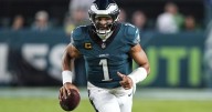 Eagles edge Cowboys in wild, lightning-delayed season opener