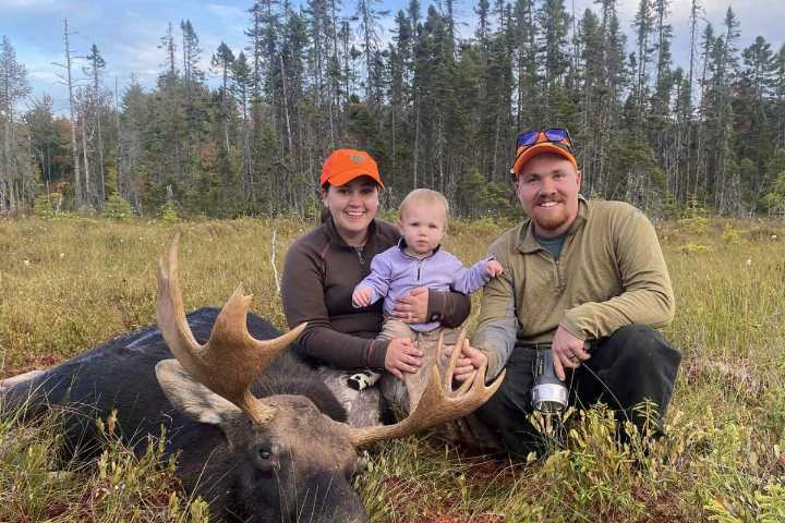 Maine woman hunts moose while carrying baby on her back
