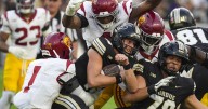 USC overcomes 3-hour delay and slow start to hold off Purdue for victory in Big Ten opener