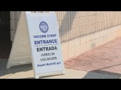 Kids get required vaccines at a back-to-school vaccination clinic