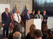 Officials ID officers killed in ambush by gunman who was inside ex