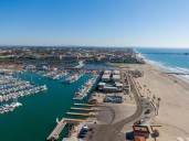 Surfers help lifeguards rescue two swept off Oceanside Jetty by waves