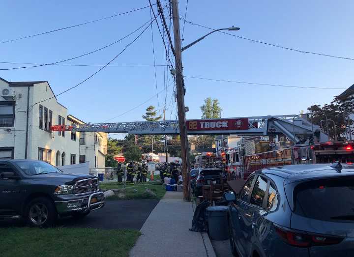 Large FDNY response at Staten Island home; ladder extended to 2nd floor