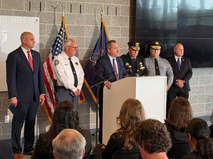 Officials ID officers killed in ambush by gunman who was inside ex