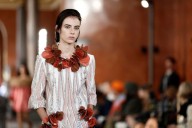 Louis Vuitton shows soft knitwear on Louvre catwalk