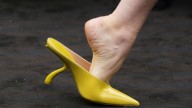 Ferragamo's chartreuse bags and shoes pop against 1920s
