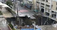 Huge sinkhole opens up outside Bangkok hospital as people forced to flee