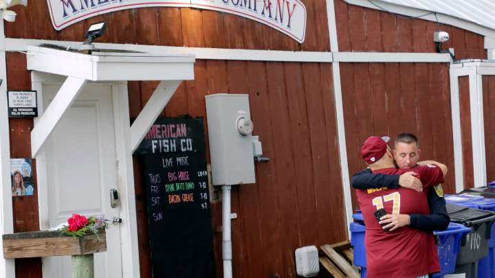 Suspect held in waterfront bar shooting that left 3 dead in North Carolina : NPR