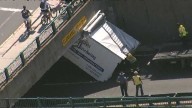 Restaurant supply truck 'storrowed' on low Boston bridge