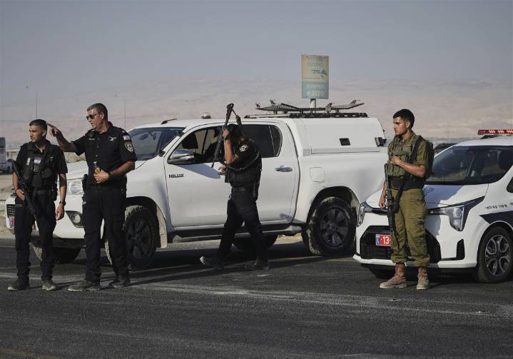 Gunman kills 2 at Israeli-run crossing between West Bank and Jordan. 4 soldiers killed in Gaza