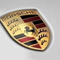 Porsche slows electric shift, prompting VW profit warning