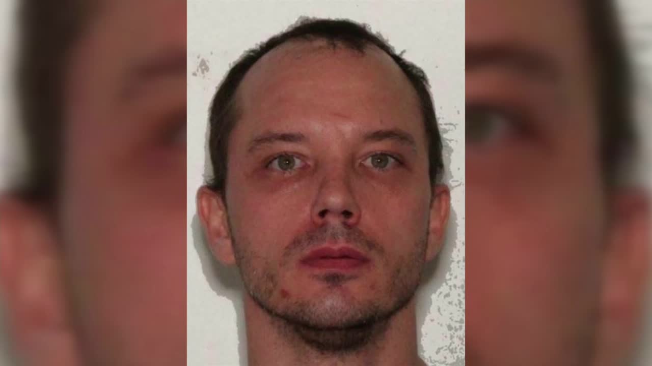 Manhunt underway for person of interest in double murder investigation