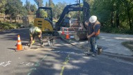 EWEB replaces power poles and moves power lines underground to make them more resilient to natural disasters
