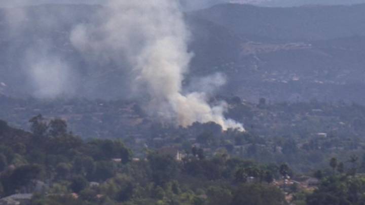 Smoke from brush fire rises over Escondido