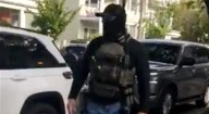 Masked agents take two from East Somerville, say state and local officials