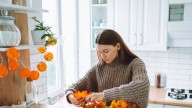The Easy DIY That Turns A Dollar Tree Kitchen Essential Into Pumpkin Wall Decor