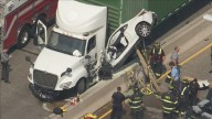Car wedged between tractor-trailer and concrete median after crash on Route 1 in Morrisville, Bucks County