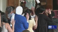 Amherst welcomes 50 new U.S. citizens in naturalization ceremony