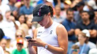 Fans spot US Open star Iga Swiatek texting from on court after destroying rival