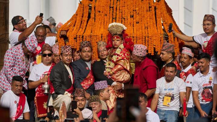 See Nepal's living goddess leave her palace to bless throngs of worshipers