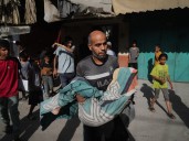 Rescuers try to save buried victims after new Israeli strike on Gaza City