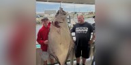 Teen fishing off New England coast catches huge halibut bigger than him