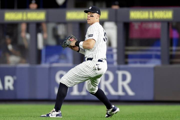 Judge throws gingerly in first outfield appearance since July 25, but insists arm is 100%