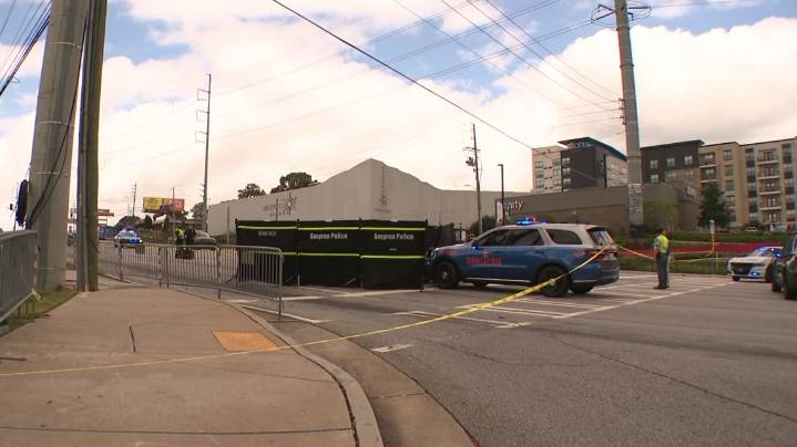 Police activity, death investigation on Cobb Parkway by The Battery