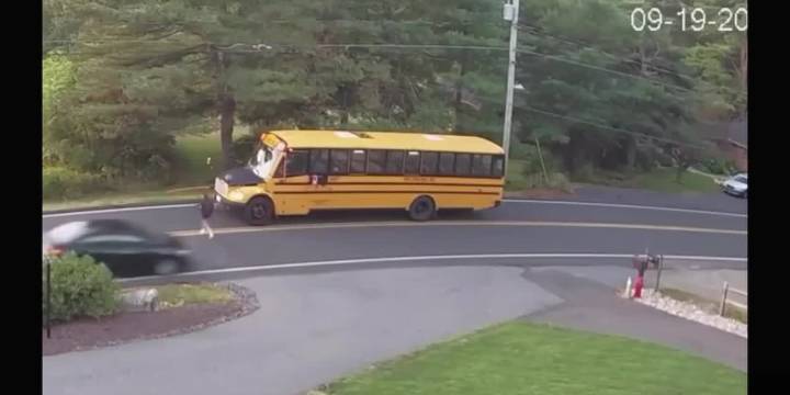 VIDEO: car nearly hits student boarding school bus