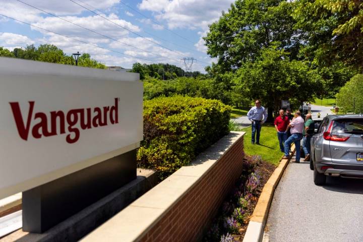 Vanguard to pay clients in conflict