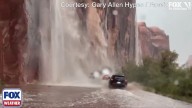 Watch: Travelers in Utah fearlessly drive through waterfalls caused by flash flooding