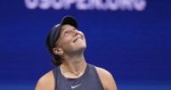 Anisimova struggles to serve with Arthur Ashe Stadium's roof closed during the US Open final