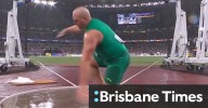 Aussie discus king slips in torrential rain