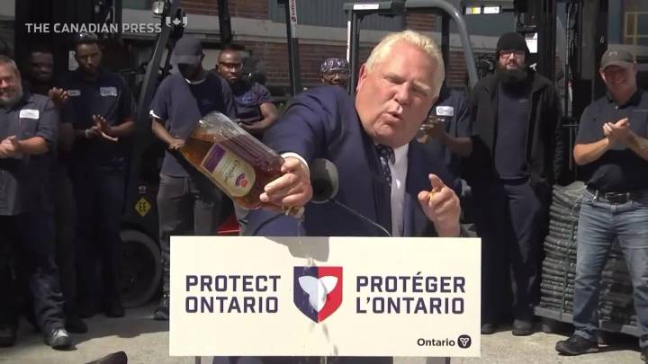 Premier Ford empties bottle of Crown Royal at press conference after company announces plant closure