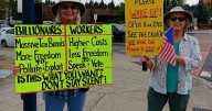 Protestors greeted with smiles and waves from passing motorists