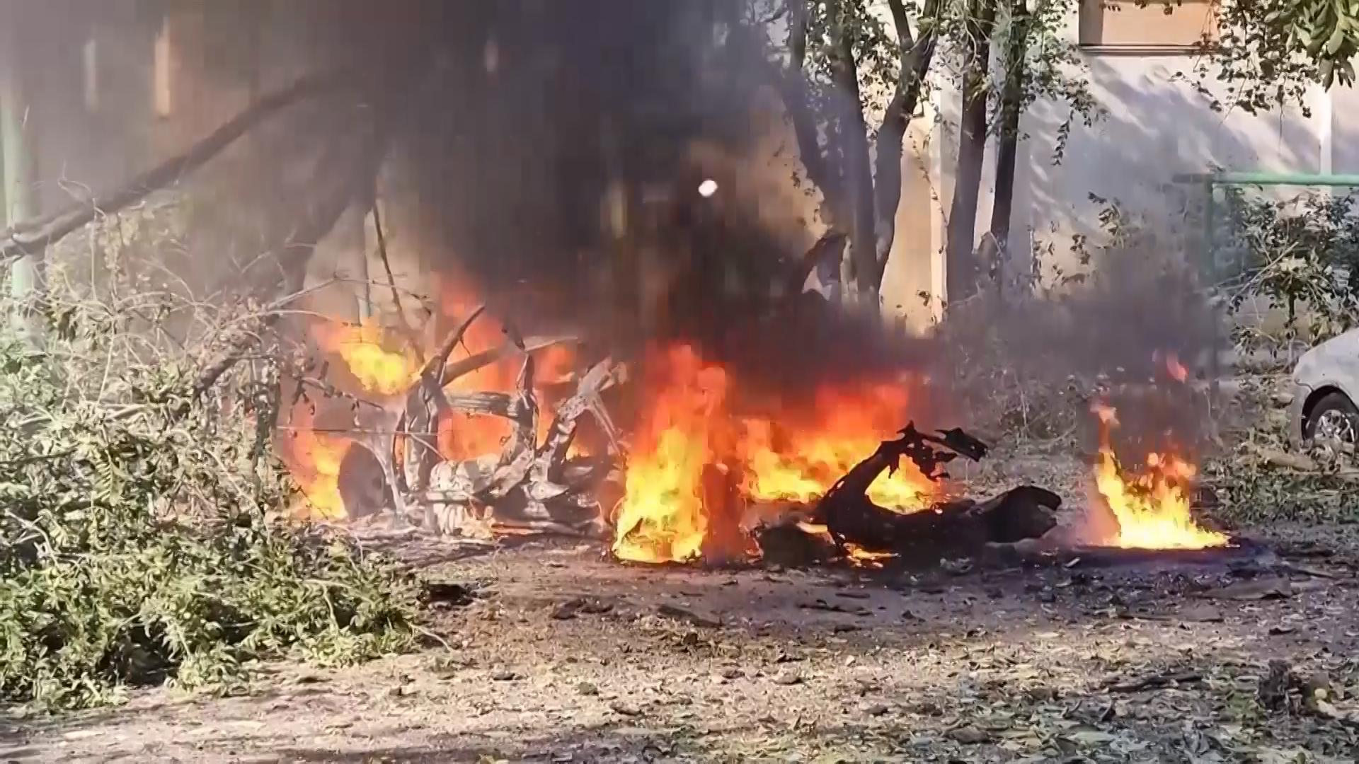 Homes and vehicles destroyed in deadly Russian strike on southern city of Kherson
