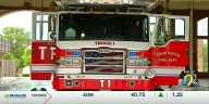 Firefighters from several districts battle fire involving tree debris pile