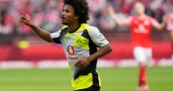 Dortmund beats Mainz 2-0 to keep pace with Bundesliga leader Bayern