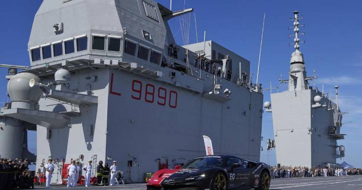 One man in an Italian supercar atop an aircraft carrier. And a record in his sights