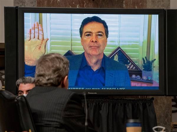 Ex-FBI Director James Comey charged with making false statement, obstruction, AP source says
