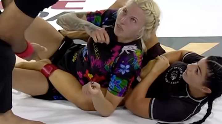 MMA fighter snaps her OWN arm while submitting opponent as fans stunned by sound it makes